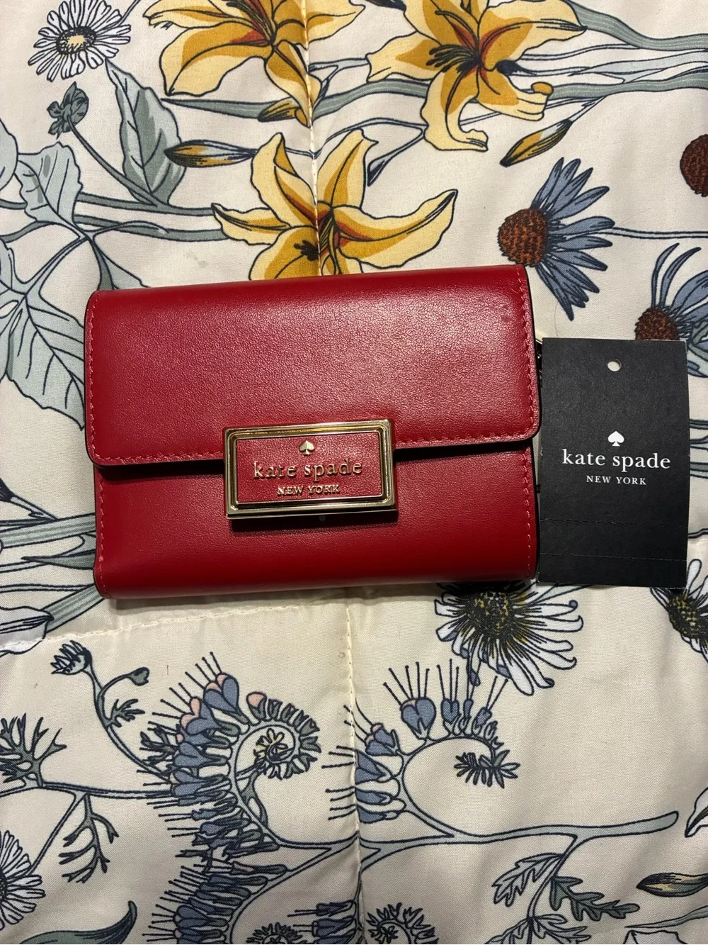 kate spade red leather compact flap wallet with gold plaque